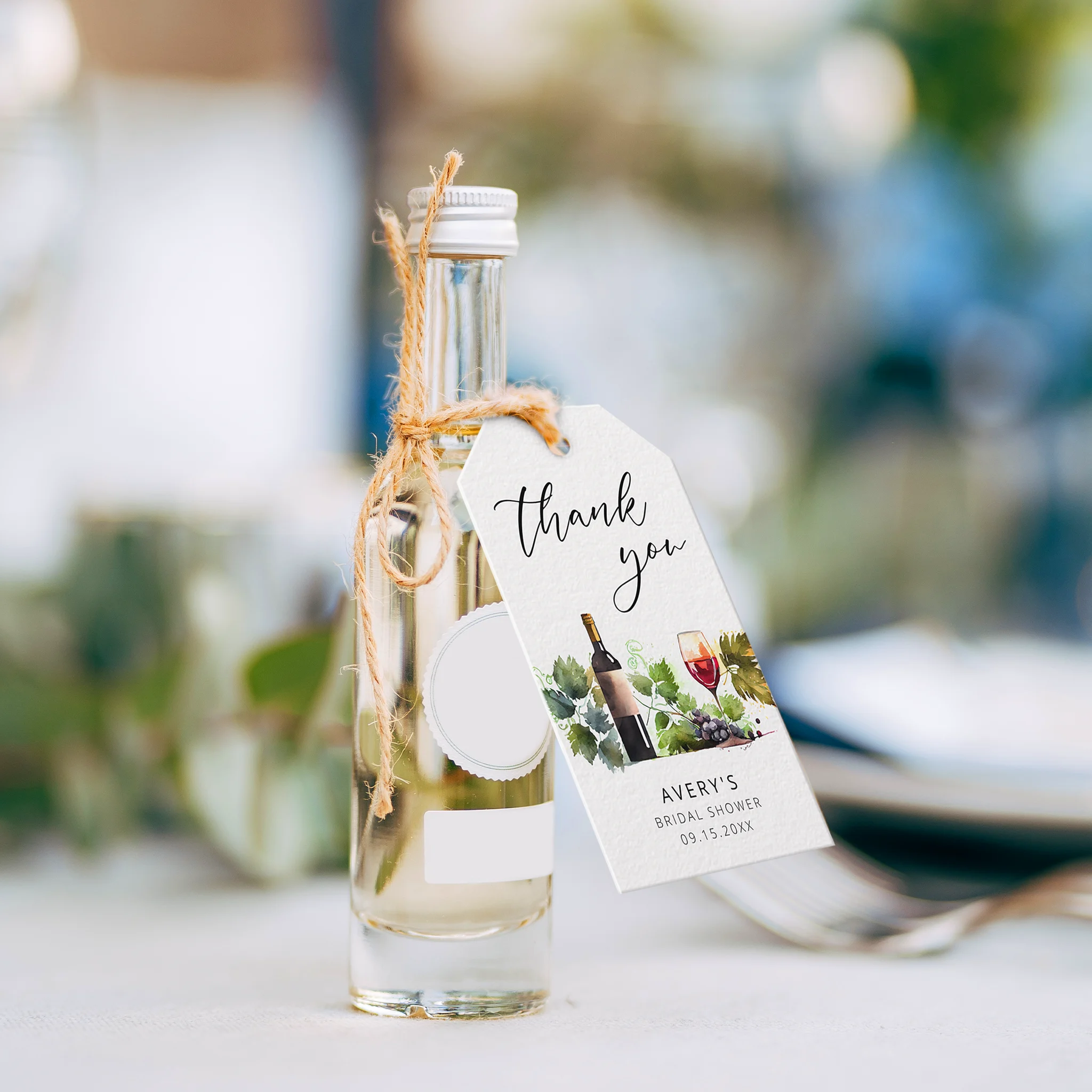 Mini wine bottles adorned with wine-themed tags, the perfect favor for your celebration.