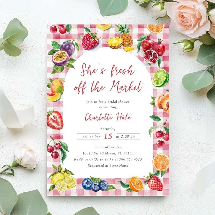 Bright and playful invitation with red script, red gingham border, and assorted watercolor fruits like berries and citrus.