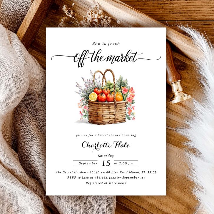 Bridal shower invitation with a watercolor basket full of tomatoes, oranges, and flowers, paired with black calligraphy.